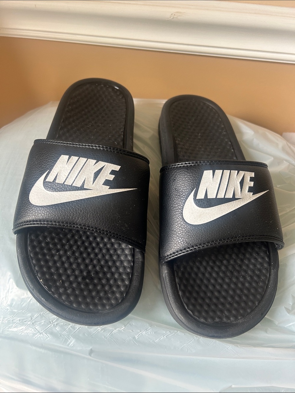 Nike Black Slides with White Swoosh Logo